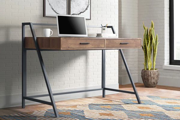 Desk with drawers in a multifunctional home office guest room space