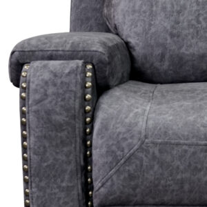 closeup of antiqued metal nailhead trim detail on the arm fronts
