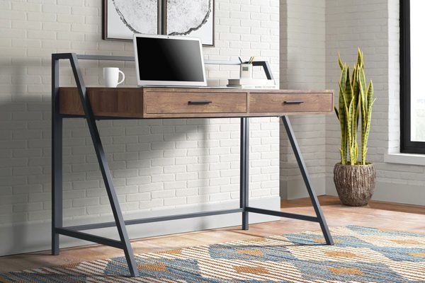 Desk with drawers in a multifunctional home office guest room space
